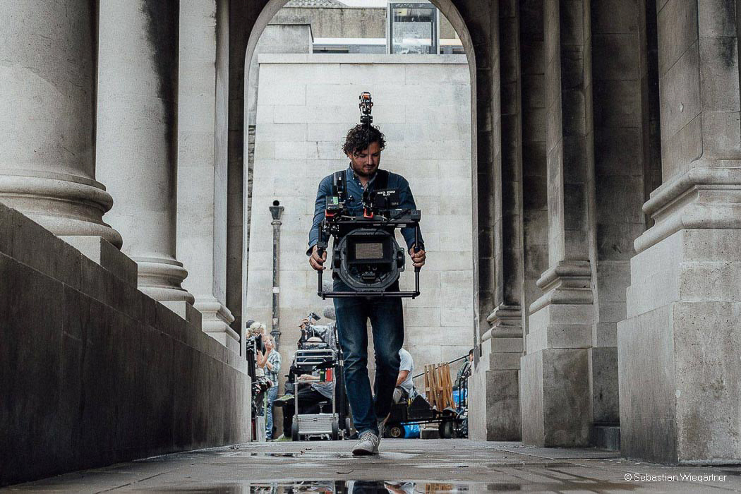 Man-holding-Gimbal-Maxima-while-walking