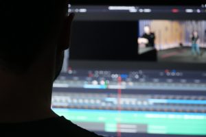 man editing a film